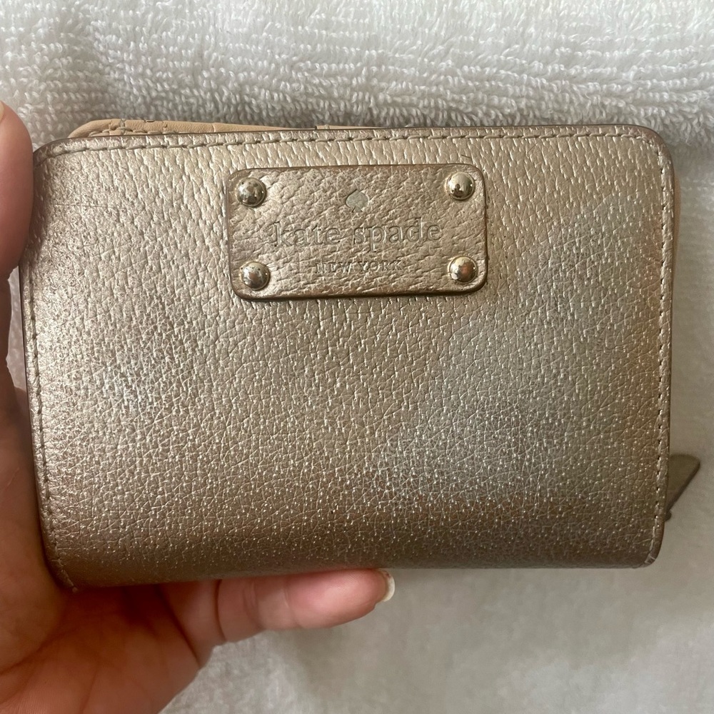 Kate Spade gold leather wallet.